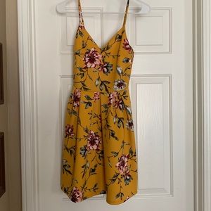 “Soprano” , yellow/gold floral dress.